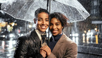 Two women are smiling and holding an umbrella together in the rain , gay couple romantic scene